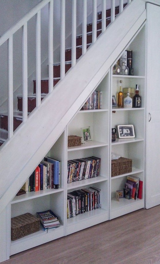 open storage compartments and a storage unit with a door are a good idea for a staircase, to save some space and store