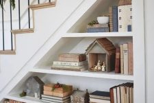 open storage shelves in the staircase will let you not only store but also display various stuff in a cool way