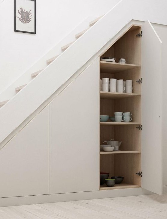 sleek hidden storage spaces with tableware are a great idea if you don't have enough space in the kitchen