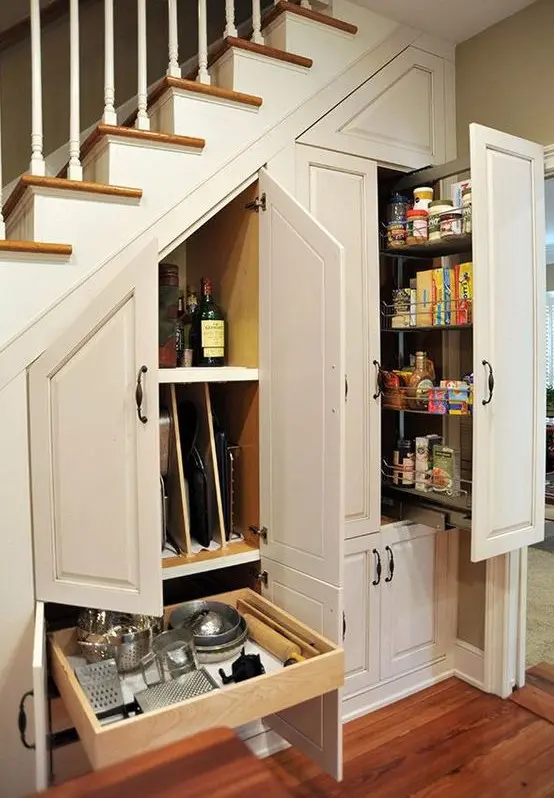 storage drawers and cabinets are great for building them into a staircase, you can have a whole pantry there