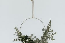 a modern meets minimalist Christmas wreath with eucalyptus and baby’s breath is a lovely idea for winter