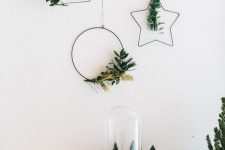 a round, star-shaped and tree-shaped Christmas wreaths with greenery and grasses are lovely for modenr holiday decor