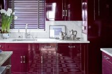 08 a super bold plum-colored kitchen with white stone countertops and a backsplash and a mosaic tile floor is wow