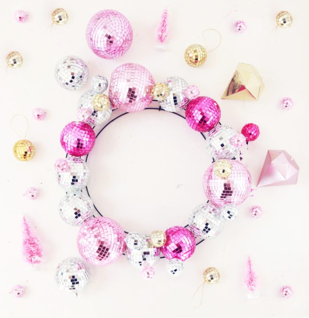 a colorful disco ball Christmas wreath in gold, silver and pink is amazing for the holidays