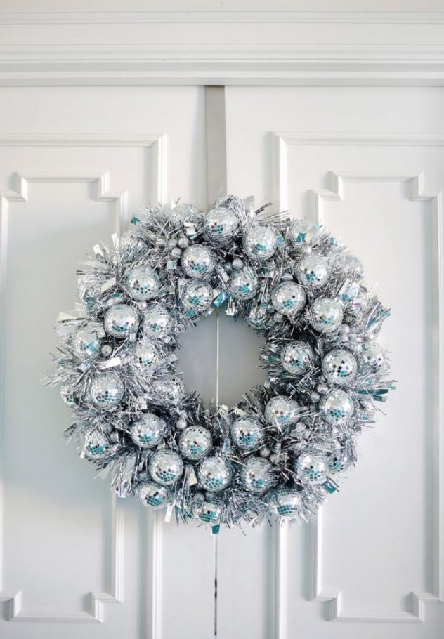 a gorgeous silver Christmas wreath of tinsel and disco balls is a stylish and catchy decoration
