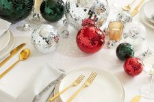 20 a neutral holiday tablescape with silver, red and dark green disco balls as a table centerpiece is awesome