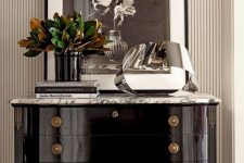 27 a beautiful black lacquer sideboard with a marble tabletop and refined knobs and legs is a cool and chic idea