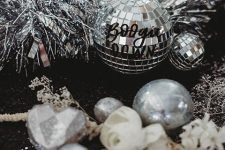 29 silver table decor with tinsel, disco balls and ornaments is always a good idea for the holidays