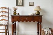 43 a refined rich-stained console table with a scallop edge and vintage legs as an antique find for a space