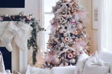 a Christmas tree done with blush, pearly and pink ornaments, some pink bows and ribbons is amazing