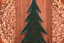 a Christmas tree string art piece of green, neutral, red yarn is a cool rustic decoration for the holidays
