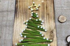 a fast and cool Christmas tree string art piece is a lovely decoration for the holidays