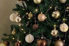 a glam Christmas tree with lights, white paper, brown and gold glitter ornaments is wow
