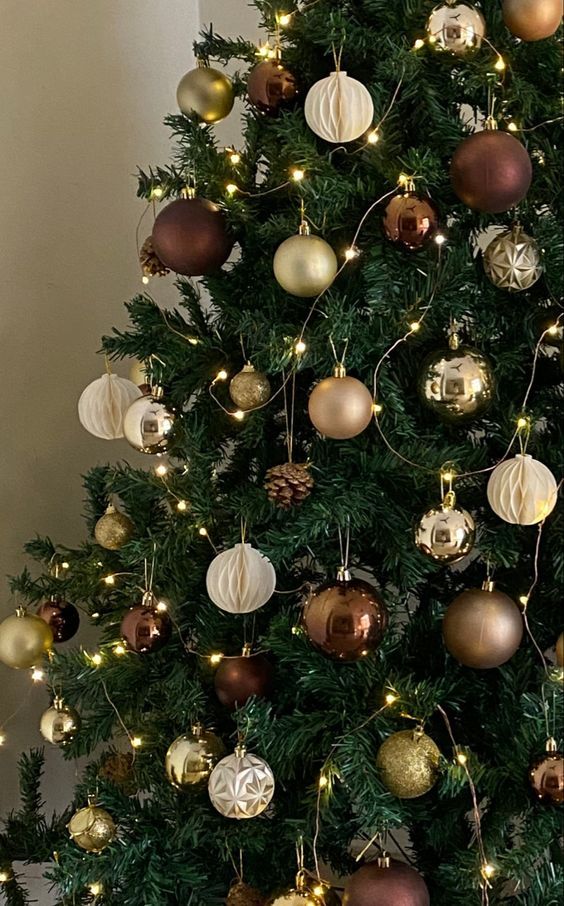 a glam Christmas tree with lights, white paper, brown and gold glitter ornaments is wow