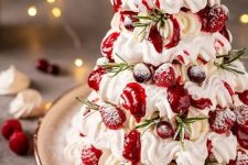 a gorgeous meringue Christmas cake with fresh berries is a perfect dessert for a holiday tea party