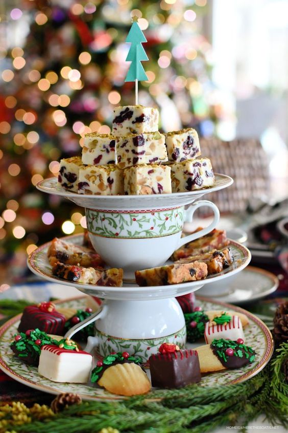 a printed stand with sweets and cake pieces is a perfect idea for a Christmas tea party