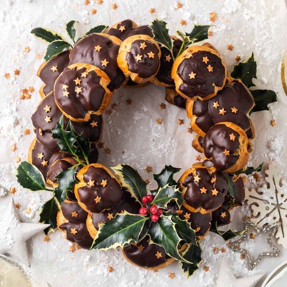 a profitrole wreath with chocolate and mistletoe is a fantastic alternative to a usual Christmas cake