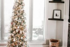 a shiny pencil Christmas tree decorated with a burlap banner, lights and various whimsical ornaments is a cool idea