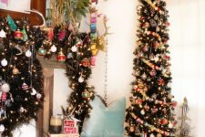 a skinny Christmas tree decorated with colorful pompom garlands and colorful ornaments and lights plus a matching garland on the mantel