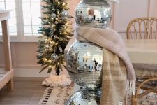a stylish slim Christmas tree looks great in a combo with a snowman