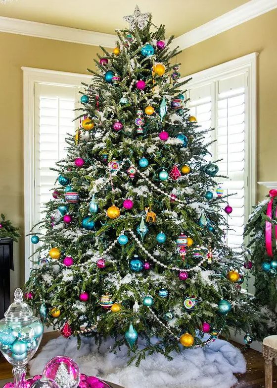 a vintage-inspired Christmas tree with beads, colorful ornaments of various shapes and a star on top