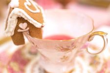 a vintage tea cup topped with a little gingerbread house is a perfect solution for a holiday tea party