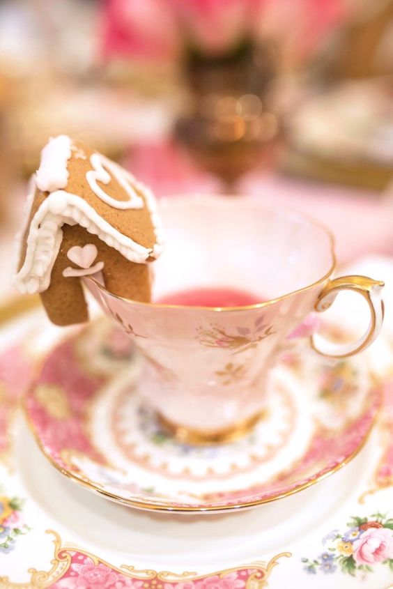 a vintage tea cup topped with a little gingerbread house is a perfect solution for a holiday tea party