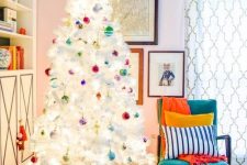 a cute white christmas tree with colorful touches