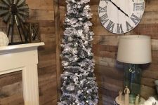 a white pencil Christmas tree with plaid ribbon, lights and monograms is a cool farmhouse decor idea