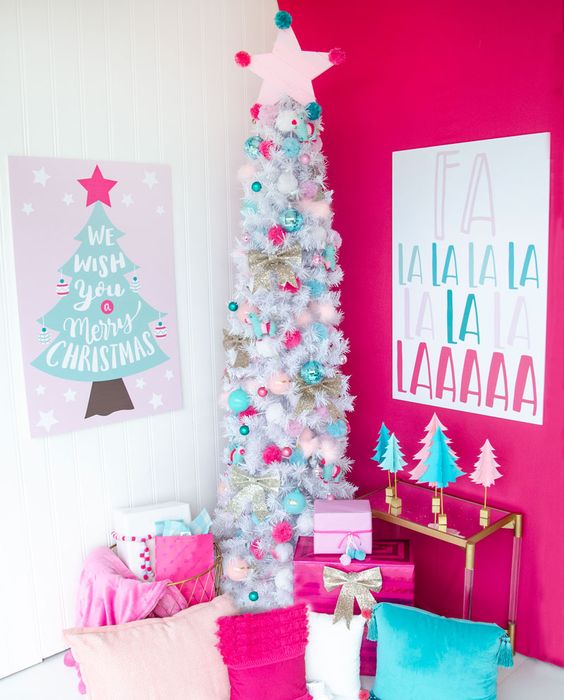 a white slim Christmas tree with turquoise and pink ornaments plus a star topper is a catchy and cool idea for a bright space