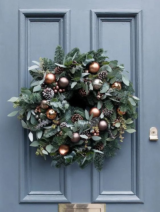 beautiful copper and brown baubles, frosted pine cones and miniature copper bells for the wreath