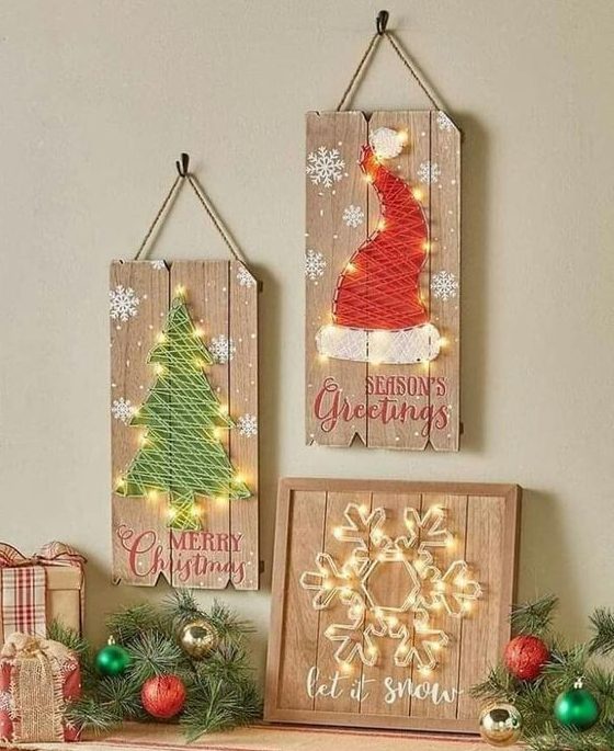 gorgeous string art pieces with lights, a snowflake, a Christmas tree and a Santa hat, with little snowflakes painted are amazing