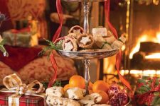 joyful holiday sweets stand and desserts displayed are rigth what you need for a Christmas tea party