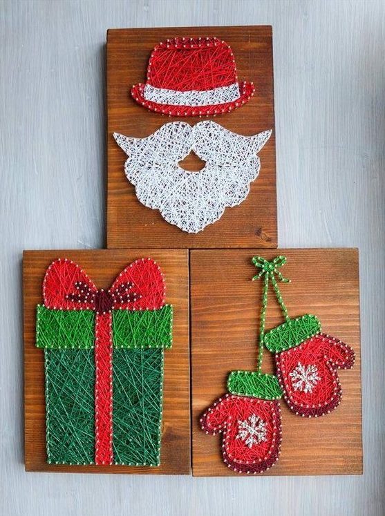 Pretty Christmas themed string art pieces with mittens, a gift and a Santa beard and hat all done in traditional Christmas colors