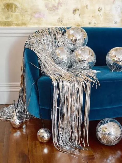 spruce up your lounge with disco balls and some silver fringe to make it ultimately bold and cool