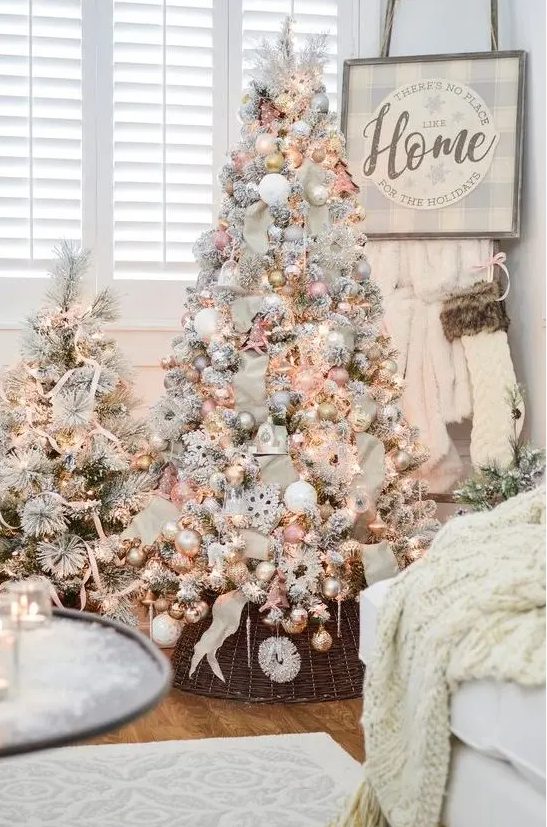 two cute snowy Christmas trees with lights, pastel and metallic ornaments and some stripes for a glam touch