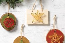 wooden Christmas ornaments of branch slices and not only, with string art showing an ornament, a star and a tree