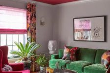 03 a catchy eclectic living room with a green sofa, a pink chair, curtain and a ceiling, a round table and a zebra print chair