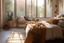 05 a light-filled earthy boho bedroom with a bed with rust bedding and a large boho rug, pillows and potted plants