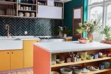 07 a colorful eclectic kitchen with emerald walls, a dark green chevron tile backsplash, bold cabinets and open shelves