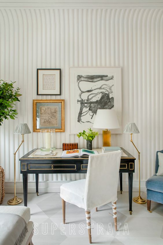 a fluted plaster wall is a unique solution for any space, and here it creates a lovely backdrop for vintage furniture