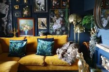 a moody navy living room with a yellow sofa