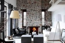 28 a contemporary living room with white walls, a whitewashed wooden ceiling, a stone clad fireplace and cool furniture