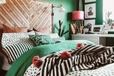 a cozy green bedroom with wood touches