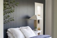 34 a black shiplap statement wall makes the bedroom more relaxed, cozy and ads a touch of drama with its color