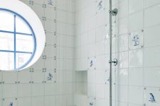 35 unusual white and blue tiles with patterns are amazing to clad a shower space to give it a vintage coastal look