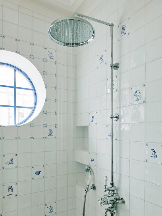 unusual white and blue tiles with patterns are amazing to clad a shower space to give it a vintage coastal look