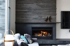 41 highlight your fireplace with weathered wood like here and some stone to make it stand out