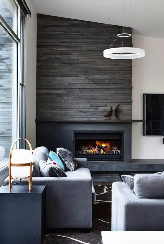 highlight your fireplace with weathered wood like here and some stone to make it stand out