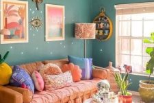 49 a colorful dopamine-infused living room with green walls, an orange sofa and colorful pillows, a bright rug and some decor
